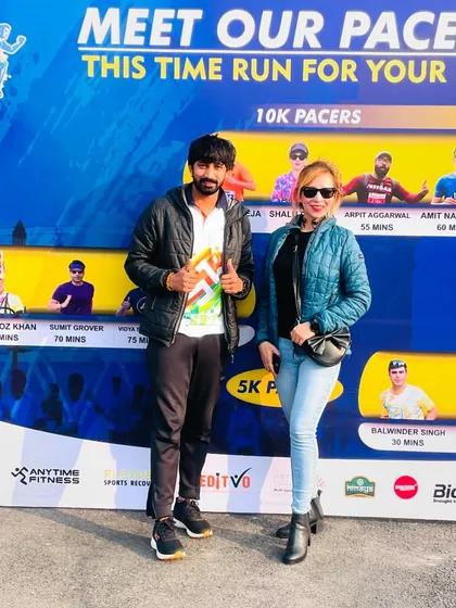 Posing with a fellow pacer at a 10K run. I often serve as a pacer or bring in experienced pacers to help runners achieve their target finish times.