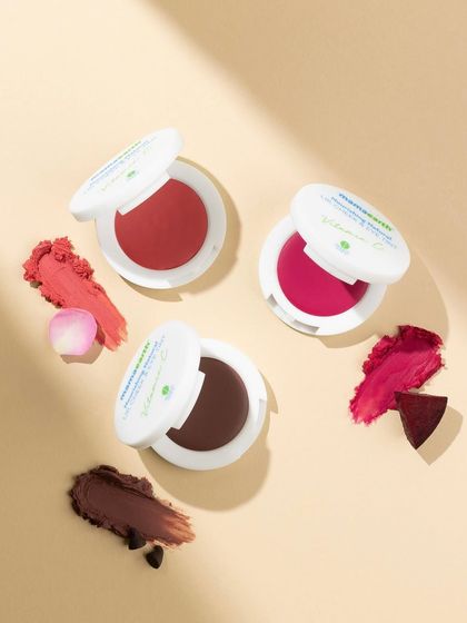 This overhead shot showcases the beautiful textures and shades of a lip tint collection. By arranging the products with their corresponding swatches, we give customers a clear and attractive preview of the color payoff.