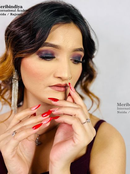 A classic combination of a dark smokey eye and bold red nails. My courses also guide you on how to suggest complementary nail and hair choices.