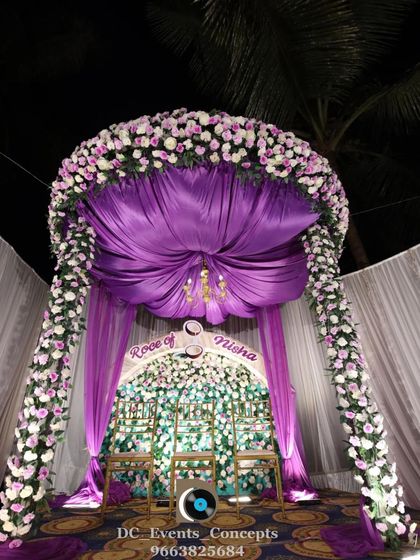 A closer look at the magnificent floral canopy for the Roce ceremony. The rich purple draping and dense flower work make this a truly breathtaking centerpiece for the event.