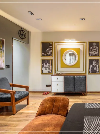 A detail shot from the bedroom in image 8, showing the gallery wall and seating area.