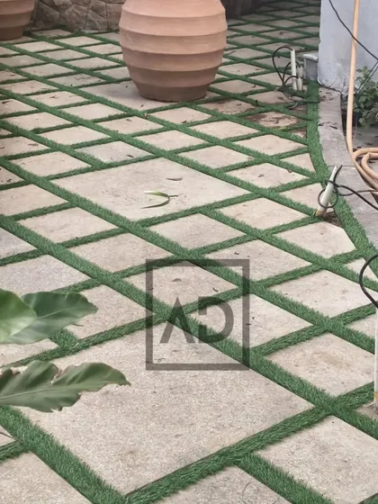 Another view of the paver and grass combination, showing how it can be used to create interesting diagonal patterns in a garden path.