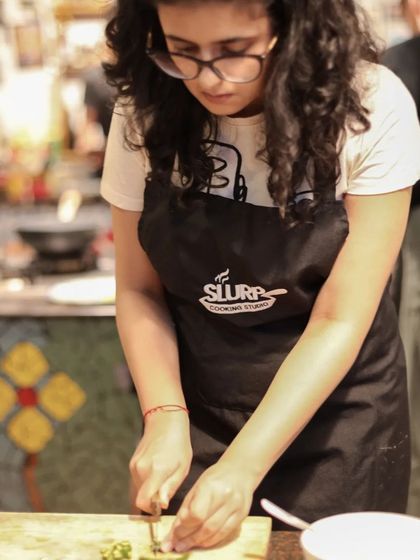 A student in our masterclass, focused on getting her cuts just right. Practice makes perfect!