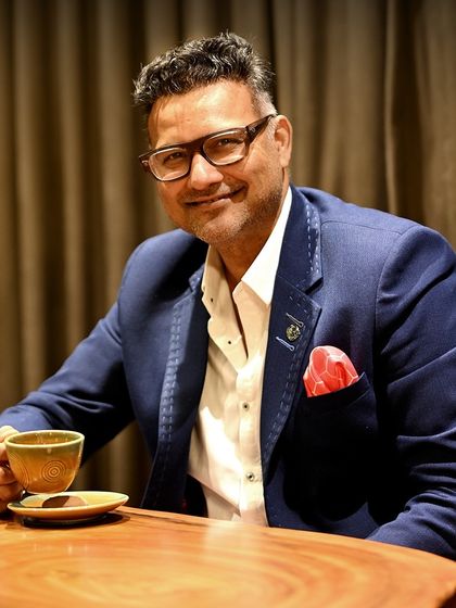 A portrait of Yogi J, the driving force behind our brand. He believes fashion is as much about people as it is about design, focusing on building a team that turns ideas into timeless elegance.