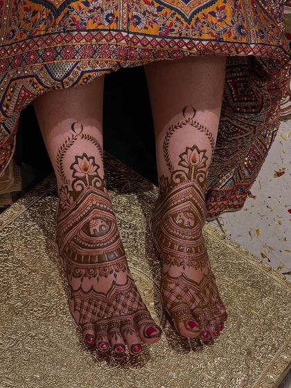 The same hanging lotus design, showing the symmetry and grace of the pattern on both feet.