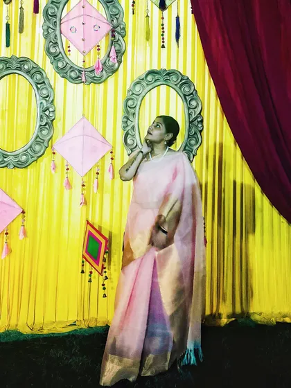 I also embrace traditional wear, like this elegant pink saree for Durga Puja. This demonstrates my versatility and ability to create content for festive seasons and brands focused on ethnic fashion.