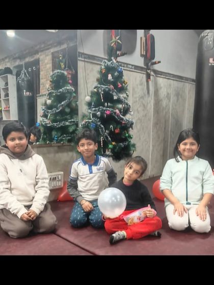 Some of our youngest students enjoying the Christmas party. It's important for them to see the dojo as a place of fun and friendship.
