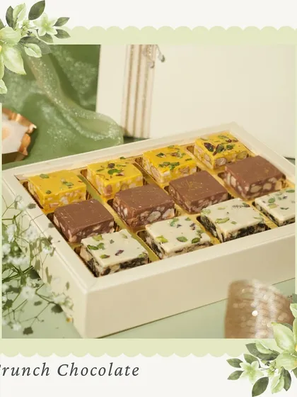 Our Crunch Chocolate bars. We offer a variety of flavors like Kesar Pista, Hazelnut Praline, and Paan, providing a unique and crunchy chocolate experience.