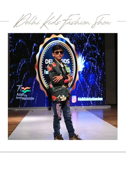 It's all about the attitude. This young model shows off his confidence and unique style in a floral blazer and denim, proving that fashion is for everyone. My events are a space for kids to express their personality and own the stage.