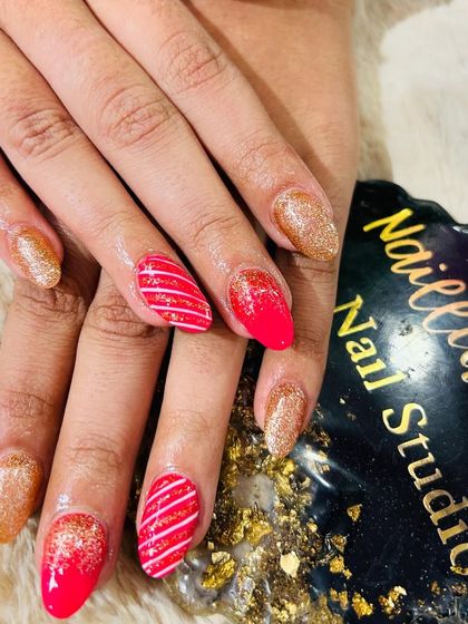 A bold Christmas set with red and gold glitter and candy cane stripes.
