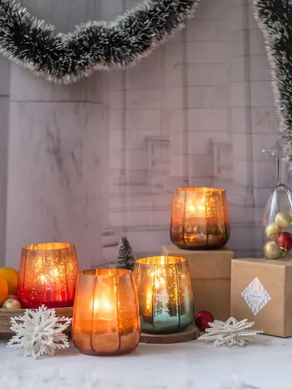 Our festive mercury glass candles are here to fill your home with love and light. The mottled finish creates a magical, sparkling effect, making them the perfect accessory for your holiday decor.