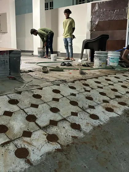 Our team at work on a residential project, installing grass pavers. This process requires precision and care to ensure a level surface and a beautiful final result.