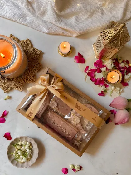 A beautifully wrapped Eid gift box, tied with a dusty rose ribbon. This highlights the elegant presentation that makes my hampers ready for gifting.