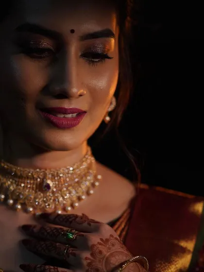 A close-up of Impana's reception makeup. This shot highlights the soft glitter on the eyes and the flawless base that is my signature style.