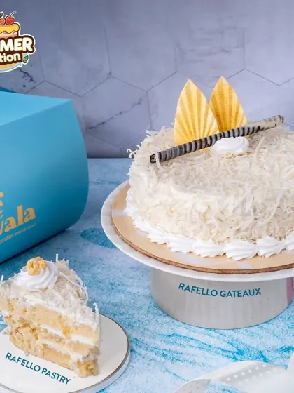 Our Raffaello Gateaux is inspired by the classic coconut and almond confection. It's a light, creamy cake covered in coconut flakes, offering a delicate and elegant flavor.