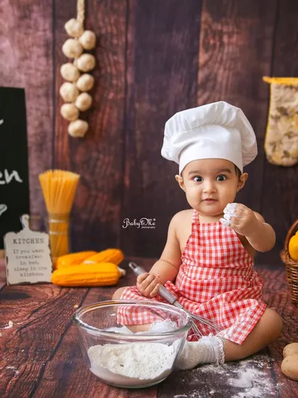 Getting her hands into the 'dough' is the most fun part. The baby chef theme allows for so many cute, interactive poses that show off your baby's budding personality.