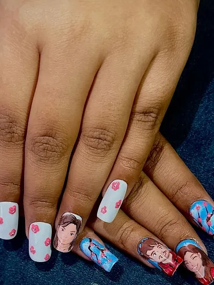 The Ghibli-inspired portrait nails being worn, showing how a personal story can be told through nail art.