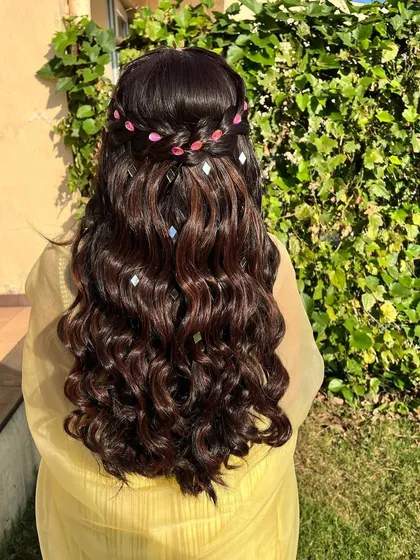Another view of this sparkling hairstyle. The way the light catches the small mirror accessories creates a beautiful, shimmering effect with every movement.
