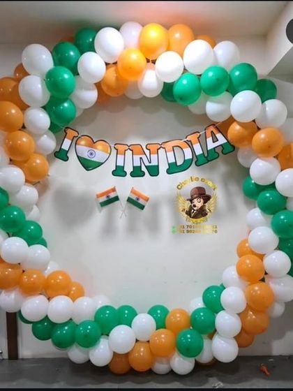 A circular balloon frame is a great option for a photo booth. For this patriotic theme, I used saffron, white, and green balloons to create a large ring, with an "I Love India" banner placed in the center.