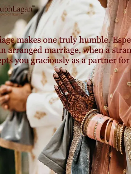 A bride's henna-adorned hand rests gently on the groom's arm. There is a beautiful humility in a stranger graciously accepting you as a partner for life.