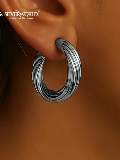 These bold, twisted hoops have an oxidized finish, giving them a contemporary and edgy look. They are substantial yet comfortable to wear.