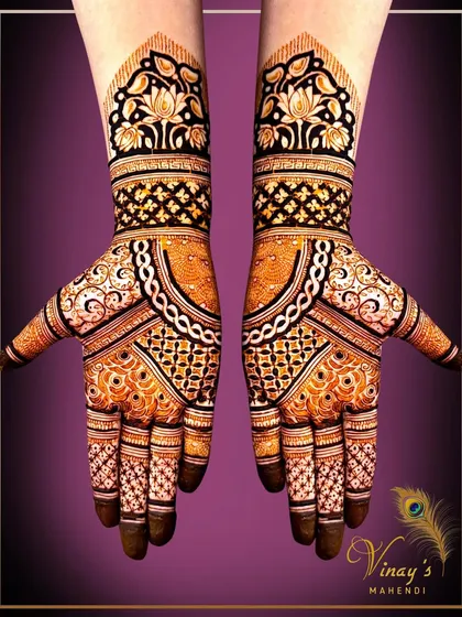 A striking symmetrical design with bold, dark floral cuffs and intricate patterns on the palms. This design is modern, edgy, and perfect for making a statement.