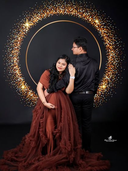 The rich, earthy tone of this brown ruffled gown is perfect for a glamorous yet grounded look, seen here in a romantic couple's portrait.
