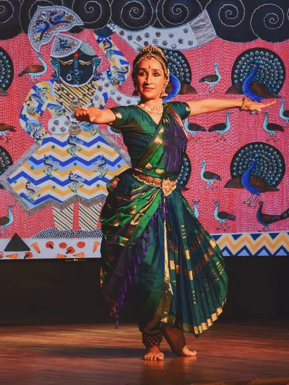 Performing 'Call of the Flute' in Jaipur, with a stunning Pichwai painting by Shan Bhatnagar as the backdrop. The visual art provides a rich canvas for the dance to unfold upon.