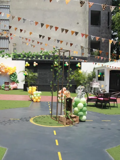 The outdoor area transformed for a Madagascar jungle theme, with animal-print bunting and decorations showing the versatility of the space.