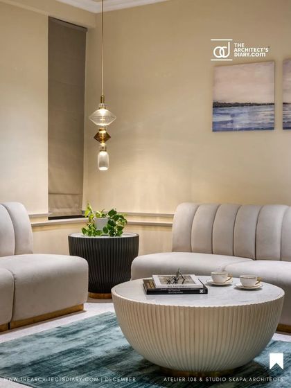 A cozy meeting nook from the Meghana Foods project, as seen in The Architect's Diary. The design focuses on warmth, comfort, and a touch of opulence.