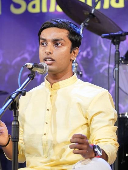 Student Keshava Gnanendran delivering his part of the Annamacharya Keerthanas.