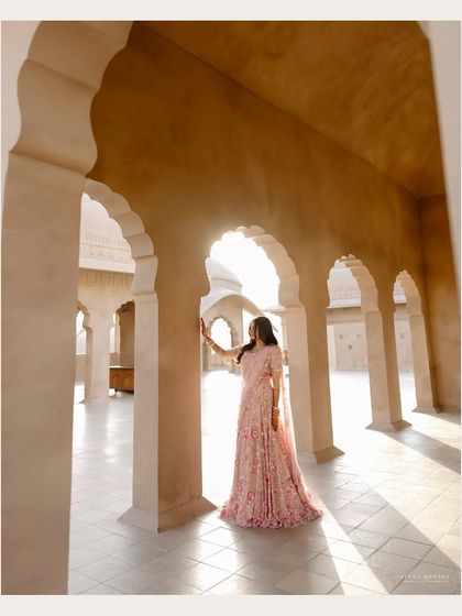 Using the arches of the palace to frame the bride. This architectural portrait creates a sense of grandeur and timelessness.