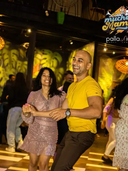 The energy at our "Mucho Mambo" socials is electric. It's the perfect place to practice what you've learned in class and just let loose on the dance floor.