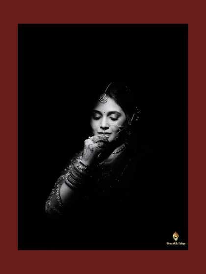 A bridal portrait is a story told in light and shadow. Here, I wanted to capture the bride's contemplative grace and the intricate details of her traditional look in a classic, monochrome frame.
