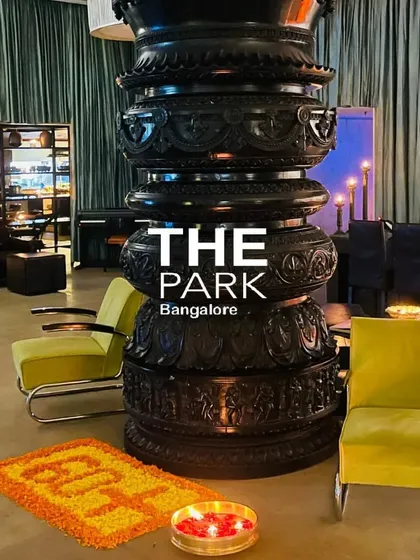 Our lobby during Earth Hour, lit by candles. The Hoysala pillar stands as a powerful silhouette, showcasing its intricate carvings even in low light.