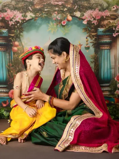 The purest laughter between a mother and her little Krishna. I focus on capturing these candid, joyful interactions that show the true bond you share, set against a vibrant, storybook backdrop.