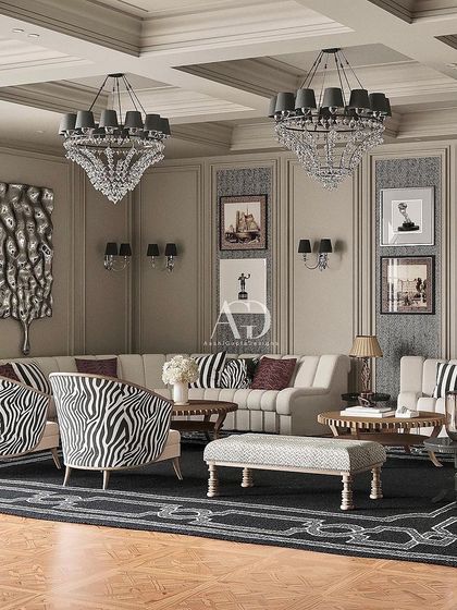 For this living room, I embraced the graphic elegance of Art Deco within a classical framework. The zebra-print armchairs provide a bold, modern counterpoint to the traditional wall paneling and crystal chandeliers, creating a polished space for entertainment.
