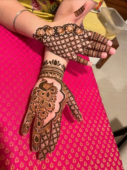 A playful design with a large peacock on one hand and a net pattern on the other.