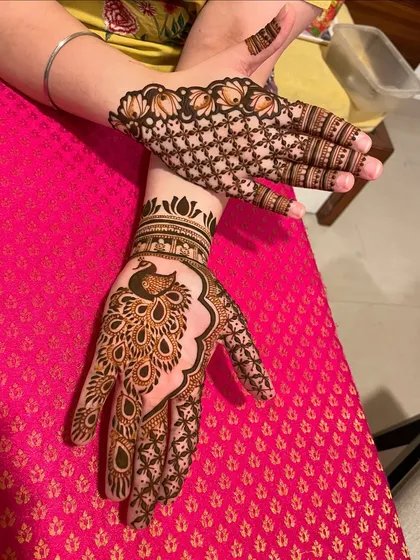 A playful design with a large peacock on one hand and a net pattern on the other.