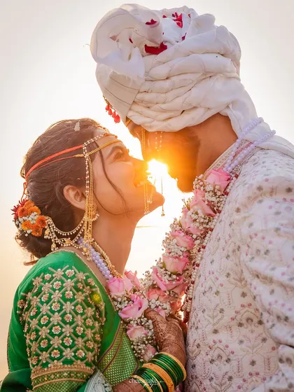 A breathtaking sunset silhouette shot. While the makeup isn't the focus, it gives the bride the confidence to create these magical, romantic moments.