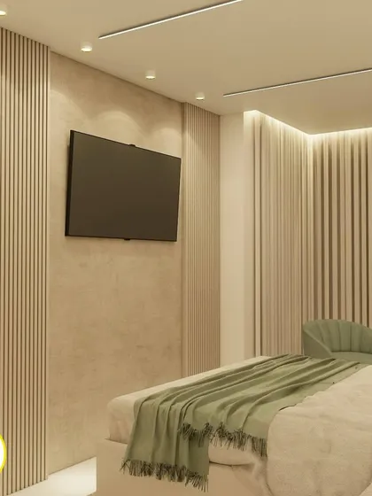 A view of the TV wall in the same bedroom, continuing the theme of fluted panels and a neutral color scheme.