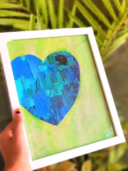 A slightly different angle of the blue and green heart, showing how the light catches the textures. It's a piece that feels both modern and organic, inspired by the colors of nature.