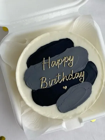For those who love a modern aesthetic, we create designs like this artistic brushstroke bento cake. The blend of black and grey tones with elegant gold script offers a chic and stylish way to celebrate.