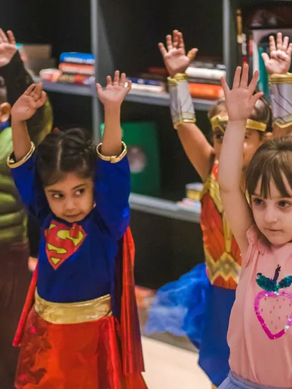 A group of our little superheroes ready to dance. Dressing up makes the class an exciting event and encourages participation.