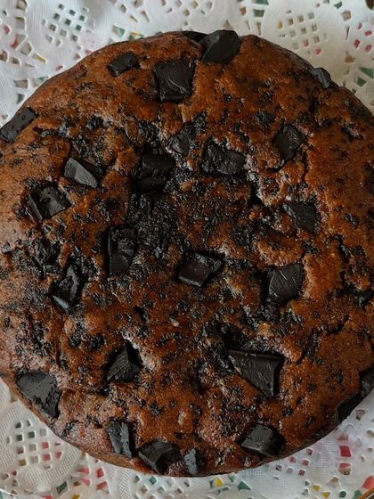 A simple, wholesome, and purely Jain-friendly chocolate chunk cake. It’s dense, moist, and packed with flavor, proving that you don’t need eggs or butter to make a truly satisfying dessert.