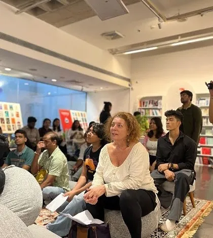 The audience listens intently during a multilingual performance. At our open mics, you will hear stories and poems in Hindi, Urdu, French, and English, celebrating the rich linguistic tapestry of our community.