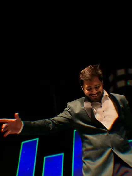 A dynamic action shot of me dancing on stage. I don't just ask you to dance, I show you how it's done.