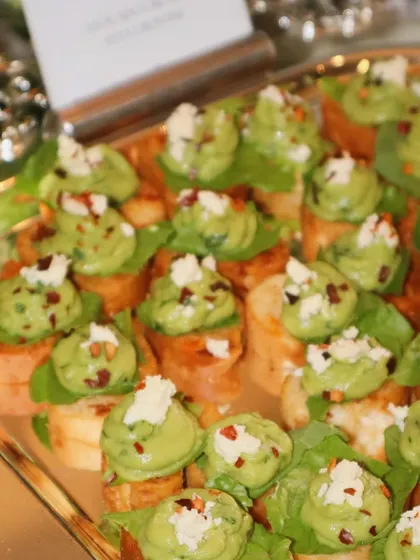 Our Avocado Mousse Crostini, topped with feta and chili flakes. The creamy avocado, salty cheese, and hint of spice make for a perfectly balanced and delicious bite.