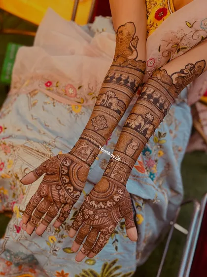 This bride wanted a classic design filled with traditional elements. I incorporated elephants, a doli (palanquin), and other auspicious symbols into her full bridal mehendi.