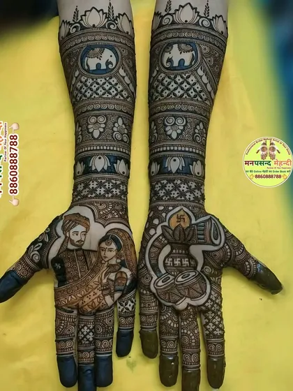 This unique design features a portrait of the couple on one hand and sacred wedding drums (dhol) on the other. The arms are filled with intricate patterns, including elephants and auspicious swastika symbols.